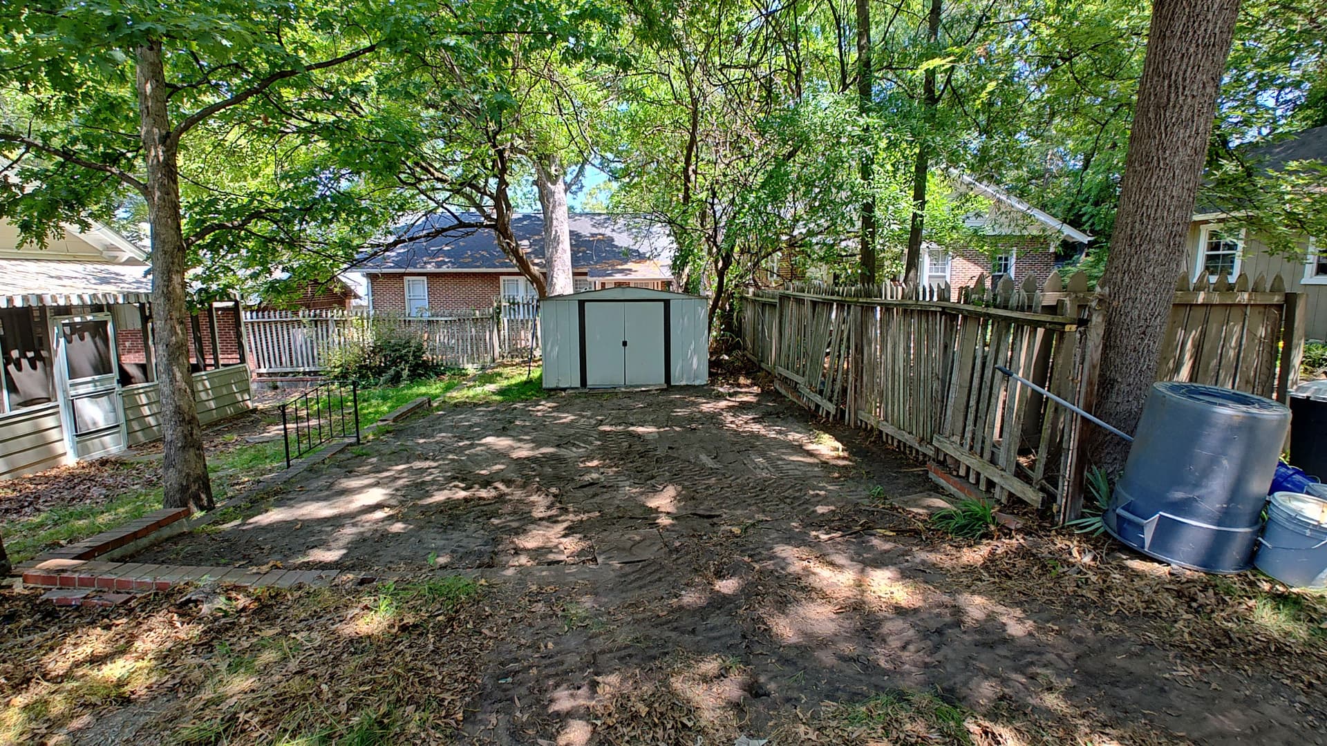 Gallery photos for Overgrown Side Yard Turned Into a Clean Gravel Parking Spot: Image #1